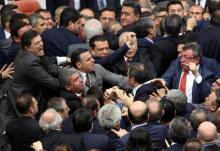 Lawmakers from ruling AK Party and the main opposition Republican People's Party (CHP) scuffle during a debate on the proposed constitutional changes at the Turkish Parliament in Ankara, Turkey, January 11, 2017. PHOTO BY REUTERS/Stringer