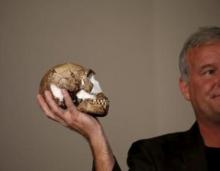 Professor Lee Berger holds a replica of the skull of a newly discovered ancient species, named "Homo naledi", during its unveiling outside Johannesburg, September 10, 2015. PHOTO BY REUTERS/Siphiwe Sibeko