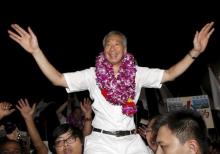 Singapore's Prime Minister and Secretary-General of the People's Action Party Lee Hsien Loong (C) celebrates with supporters after the general election results at a stadium in Singapore September 12, 2015. PHOTO BY REUTERS/Edgar Su