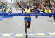 Lelisa Desisa of Ethiopia crosses the finish line to win the 119th Boston Marathon. PHOTO BY Winslow Townson-USA TODAY Sports