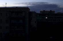 A single light illuminates a room during a blackout at a residential building in Yevpatoriya, Crimea, December 2, 2015. PHOTO BY REUTERS/Pavel Rebrov