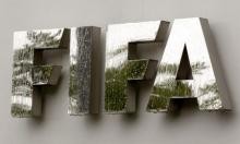 Water flows over the FIFA logo in front of the FIFA headquarters during heavy rainfall in Zurich, July 22, 2011. PHOTO BY REUTERS/Arnd Wiegmann