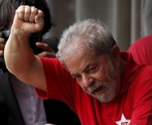 Former Brazilian President Luiz Inacio Lula da Silva waves to the crowd from his home in Sao Bernardo do Campo, Brazil, March 5, 2016. PHOTO BY REUTERS/Paulo Whitaker