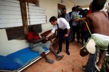France's President Emmanuel Macron talks with residents during his visit to the French Caribbean island of St. Martin, September 12, 2017. PHOTO BY REUTERS/Christophe Ena