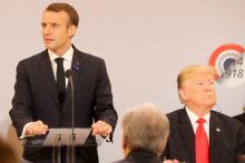 French President Emmanuel Macron delivers a speech as U.S. President Donald Trump looks on, before a lunch at the Elysee Palace, during commemorations for Armistice Day, 100 years after the end of World War One, in Paris, France, November 11, 2018. PHOTO BY REUTERS/Jacques Demarthon