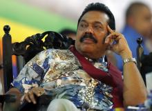 Sri Lankan President Mahinda Rajapaksa listens to a speech during his final rally ahead of presidential election in Piliyandala, January 5, 2015. PHOTO BY REUTERS/Dinuka Liyanawatte
