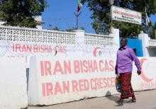 A Somali man walks in front of the Iranian Red Crescent premises after the government ordered all Iran-related operations to leave within 72 hours in Mogadishu, January 12, 2016. PHOTO BY REUTERS/Feisal Omar