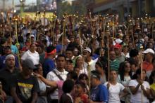 People take part in a march to demand the resignation of Honduras' President Juan Hernandez in Tegucigalpa, June 26, 2015. PHOTO BY REUTERS/Jorge Cabrera