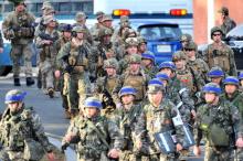 U.S. and South Korean (blue head bands) marines take part in a U.S.-South Korea joint landing operation in Pohang, South Korea, March 7, 2016. PHOTO BY REUTERS/Choi Chang-ho