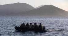 Members of the Philippine marines are transported on a rubber boat from a patrol ship, after a mission at the disputed Second Thomas Shoal, part of the Spratly Islands in the South China Sea, as they return to a naval forces camp in Palawan province, southwest Philippines, March 31, 2014. PHOTO BY REUTERS/Erik De Castro
