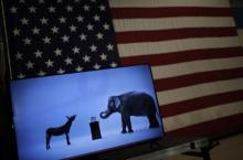 The mascots of the Democratic and Republican parties, a donkey for the Democrats and an elephant for the GOP, are seen on a video screen at Democratic U.S. presidential candidate Hillary Clinton's campaign rally in Cleveland, Ohio, March 8, 2016. PHOTO BY REUTERS/Carlos Barria