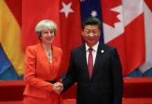 Chinese President Xi Jinping (R) shakes hands with Britain's Prime Minister Theresa May during the G20 Summit in Hangzhou, Zhejiang province, China, September 4, 2016. PHOTO BY REUTERS/Damir Sagolj