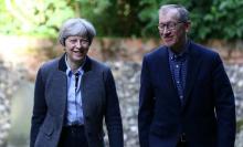 Britain's Prime Minister Theresa May and her husband Phillip (R) arrive at church in Sonning, Britain, May 28, 2017. PHOTO BY REUTERS/Neil Hall