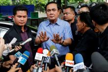 Thai Prime Minister Prayuth Chan-ocha talks to media at a polling station during a constitutional referendum vote in Bangkok, Thailand, August 7, 2016. PHOTO BY REUTERS/Jorge Silva