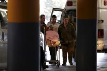 An Israeli medic wheels a soldier, one of six wounded in what the Israeli military said was Friday's second Palestinian car ramming attack in the West Bank, to a hospital in Jerusalem, November 27, 2015. PHOTO BY REUTERS/Ammar Awad