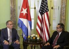 Chief of Mission at the U.S. Interests Section in Havana Jeffrey DeLaurentis (L) talks to Cuba's interim Foreign Minister Marcelino Medina in Havana, July 1, 2015. PHOTO BY REUTERS/Enrique de la Osa