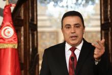 Tunisia's Prime Minister Mehdi Jomaa speaks during a news conference announcing his decision not to run for the upcoming presidential election in Tunis