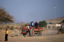 Men ride on the back of a tractor in Mapela village near the Mogalakwena platinum mine in Mokopane, Limpopo province, South Africa, September 20, 2017. PHOTO BY REUTERS/Siphiwe Sibeko