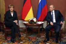 Russian President Vladimir Putin meets with German Chancellor Angela Merkel in Deauville, Northern France