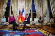 French President Emmanuel Macron and German Chancellor Angela Merkel pose during their meeting at the Elysee Palace in Paris, France, January 19, 2018. PHOTO BY REUTERS/Christophe Petit Tesson