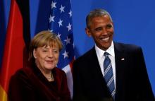 U.S. President Barack Obama and Chancellor Angela Merkel smile at the conclusion of their joint press conference at the German Chancellery in Berlin, Germany, November 17, 2016. PHOTO BY REUTERS/Kevin Lamarque