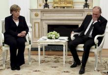 Russian President Vladimir Putin (R) meets with German Chancellor Angela Merkel at the Kremlin in Moscow, Russia, May 10, 2015. PHOTO BY REUTERS/Sergei Karpukhin