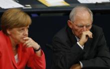 German Chancellor Angela Merkel and Finance Minister Wolfgang Schaeuble attend the session of Germany's parliament, the Bundestag, in Berlin, Germany, July 17, 2015. PHOTO BY REUTERS/Axel Schmidt