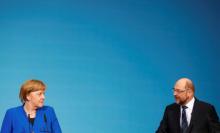 Acting German Chancellor Angela Merkel and Social Democratic Party (SPD) leader Martin Schulz attend a news conference after exploratory talks about forming a new coalition government at the SPD headquarters in Berlin, Germany, January 12, 2018. PHOTO BY REUTERS/Hannibal Hanschke