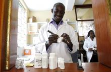 Michael Otieno, a pharmacist, dispenses anti-retroviral (ARV) drugs at the Mater Hospital in Kenya's capital Nairobi, September 10, 2015. PHOTO BY REUTERS/Thomas Mukoya