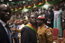 Burkina Faso's President Michel Kafondo (C, with sash) is seen after being sworn into his post for the transitional period of one year, in Ouagadougou, November 21, 2014. PHOTO BY REUTERS/Joe Penney