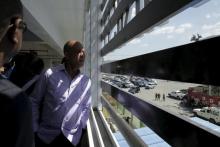 Outgoing Haiti's President Michel Martelly looks outside of the Ministry of Interior during the inauguration of the new building in Port-au-Prince, Haiti, February 4, 2016. PHOTO BY REUTERS/Andres Martinez Casares