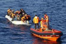 A Turkish Coast Guard fast rigid-hulled inflatable boats tow refugees and migrants in a dinghy on the Turkish territorial waters of the North Eagean Sea, following a failed attempt of crossing to the Greek island of Lesbos, off the shores of Canakkale, Turkey, November 9, 2015. PHOTO BY REUTERS/Umit Bektas