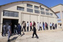 Migrants walk to a detention center run by the interior ministry of Libya's eastern-based government, in Benghazi, Libya, October 9, 2017. PHOTO BY REUTERS/Esam Omran Al-Fetori