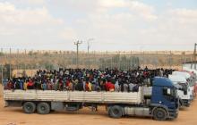 Migrants in trucks arrive at a detention center in Gharyan, Libya, October 12, 2017. PHOTO BY REUTERS/Hani Amara