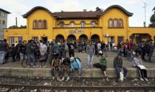 A group of immigrants who have made through police blockades arrive at the Gevgelija railway station, August 21, 2015. PHOTO BY REUTERS/Ognen Teofilovski