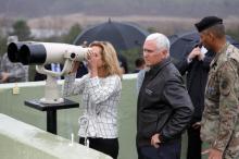U.S. Vice President Mike Pence stands next to her daughter looking toward the north through a pair of binocular from an observation post inside the demilitarized zone separating the two Koreas, in Paju, South Korea, April 17, 2017. PHOTO BY REUTERS/Kim Hong-Ji