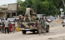 A man cycles past a military truck in Maiduguri, Borno State, Nigeria, August 31, 2016. PHOTO BY REUTERS/Afolabi Sotunde
