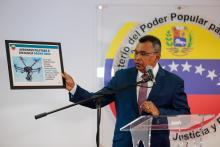 Venezuela's Interior and Justice Minister Nestor Reverol holds a placard with a picture of a drone during a news conference in Caracas, Venezuela, August 5, 2018. PHOTO BY REUTERS/Ministry of Interior and Justice