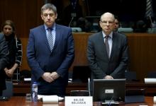 Belgian Interior Minister Jan Jambon and Justice Minister Koen Geens (R) observe a minute of silence to victims of Tuesday's bombings during an extraordinary meeting of European Union interior and justice ministers in Brussels, Belgium, March 24, 2016. PHOTO BY REUTERS/Francois Lenoir