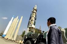 A man looks at Iranian-made missiles at Holy Defence Museum in Tehran, September 23, 2015. PHOTO BY REUTERS/Raheb Homavandi