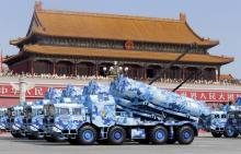 Military vehicles carrying shore-to-ship missiles drive past the Tiananmen Gate during a military parade to mark the 70th anniversary of the end of World War Two, in Beijing, China, September 3, 2015. PHOTO BY REUTERS/Jason Lee