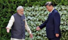 Indian Prime Minister Narendra Modi (L) and Chinese President Xi Jinping leave after a group picture during BRICS (Brazil, Russia, India, China and South Africa) Summit in Benaulim, in the western state of Goa, India, October 16, 2016. PHOTO BY REUTERS/Danish Siddiqui