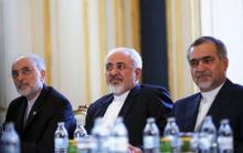 Iranian Foreign Minister Mohammad Javad Zarif (C), Head of the Iranian Atomic Energy Organization Ali Akbar Salehi and Hossein Fereydoon (R), brother and close aide to President Hassan Rouhani meet with U.S. Secretary of State John Kerry (not pictured) at a hotel in Vienna, Austria July 3, 2015. PHOTO BY REUTERS/Carlos Barria