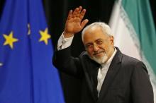 Iranian Foreign Minister Mohammad Javad Zarif waves after a plenary session at the United Nations building in Vienna, Austria, July 14, 2015. PHOTO BY REUTERS/Leonhard Foeger