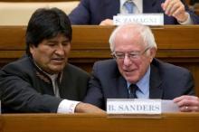 U.S. Democratic presidential candidate Bernie Sanders (R) speaks with Bolivia president Evo Morales (L) as they attend a conference at the Vatican , April 15, 2016. PHOTO BY REUTERS/Andrew Medichini