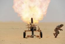 A Saudi soldier fires a mortar towards Houthi movement position, at the Saudi border with Yemen, April 21, 2015. PHOTO BY REUTERS/Stringer