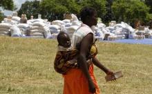 A Zimbabwean mother arrives to collect her monthly rations of food aid from Rutaura Primary School in the Rushinga district of Mt Darwin about 254km north of Harare, March 7, 2013. PHOTO BY REUTERS/Philimon Bulawayo