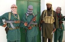 Sheik Muktar Robow Abu Mansur (2nd R), spokesman of Somalia's Islamic al-Shabab, leaves a news conference after vowing to step up attacks against government soldiers and foreign troops in a file photo. PHOTO BY REUTERS/Feisal Omar