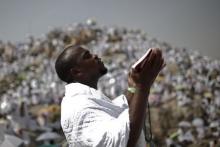 A Muslim pilgrim prays on Mount Mercy on the plains of Arafat during the annual haj pilgrimage, outside the holy city of Mecca, September 23, 2015. PHOTO BY REUTERS/Ahmad Masood