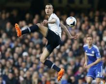 Tottenham Hotspur's Nabil Bentaleb jumps for the ball during their English Premier League soccer match against Chelsea at Stamford Bridge in London